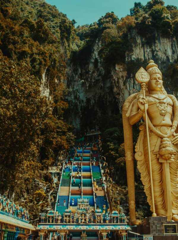 Majestic statue of Lord Murugan at Batu Caves, a famous tourist destination in Malaysia.