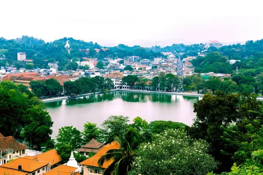 A picturesque view of Kandy city with its lush landscapes and serene lake, Sri Lanka.