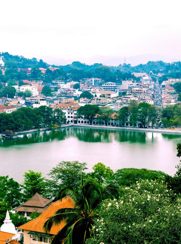 A picturesque view of Kandy city with its lush landscapes and serene lake, Sri Lanka.